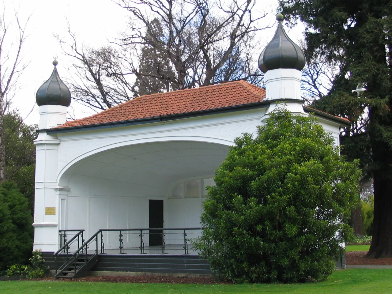 Bandstand in the Dunedin Botanic Garden, New Zealand. 
The plaque reads "Restoration of this bandstand was made possible by a grant from AMP Perpetual Trustee Company N.Z. Ltd. 1989"