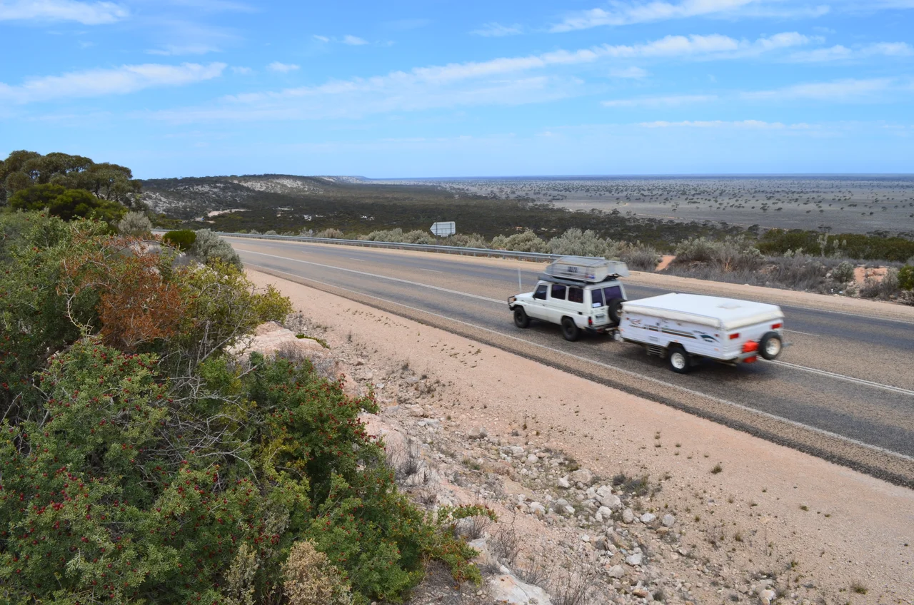 View of the Madura Pass on the Eyre Highway, Western Australia.  At the foot of the escarpment at the centre left of the image is the Madura roadhouse, and in the background at right are the Roe Plains.