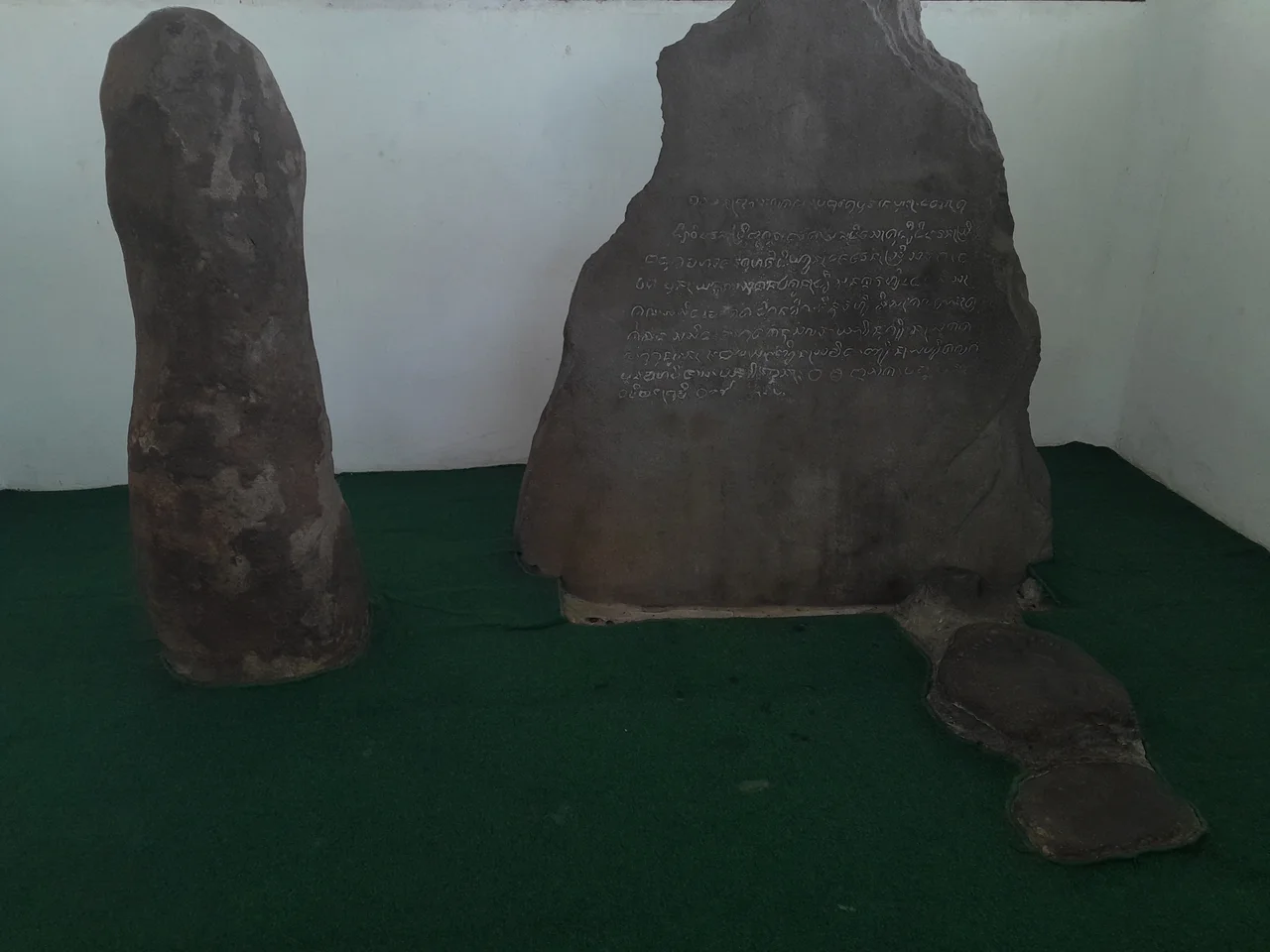 Inside the housing of Batutulis Inscription are these stones and another one not pictured.