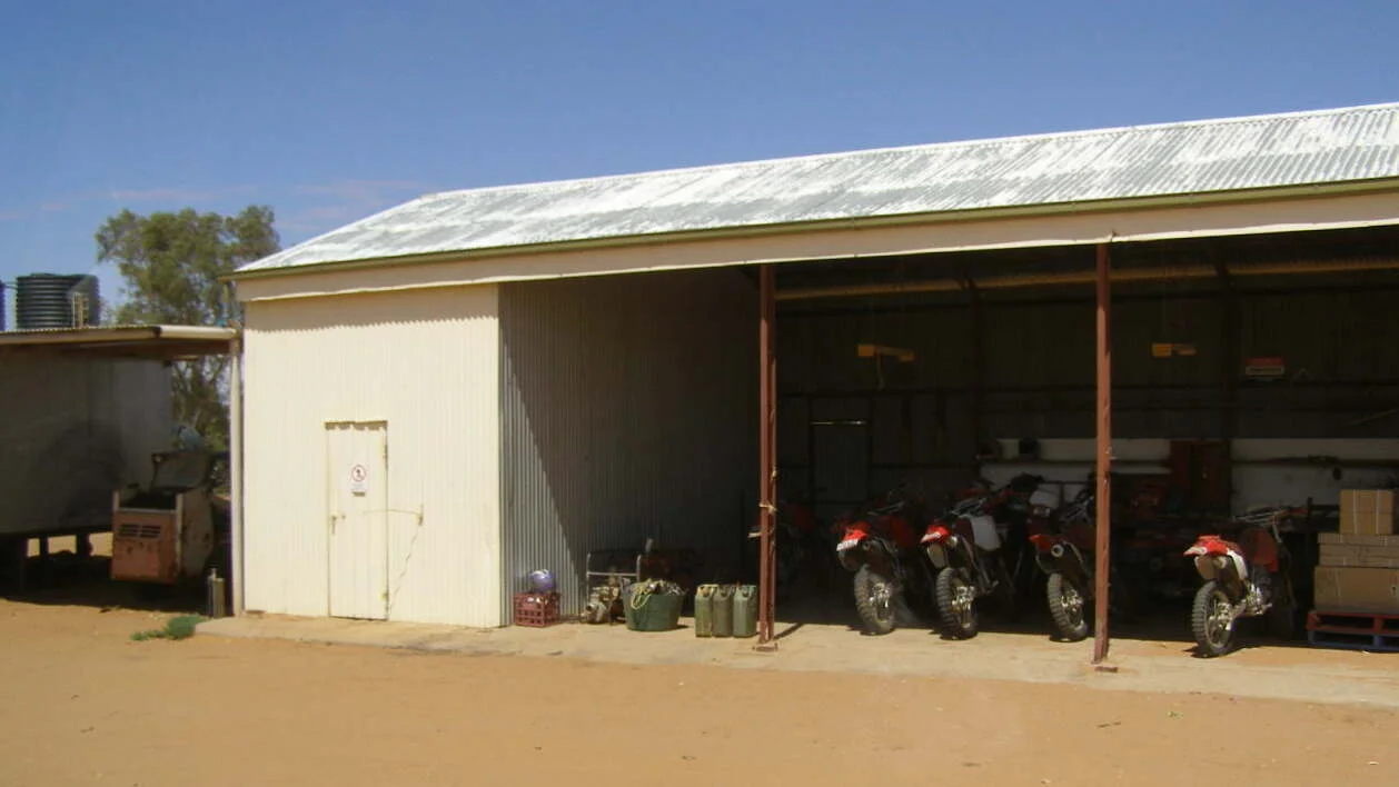 Trailbikes used in mustering, Anna Creek homestead, South Australia