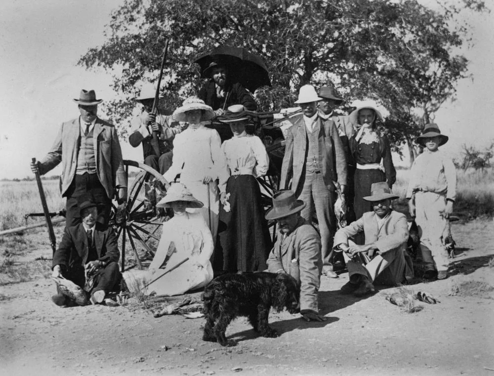 Shooting party at Isis Downs Station, Blackall district, ca. 1905
Men, women and a young boy, along with a dog, are part of this party.