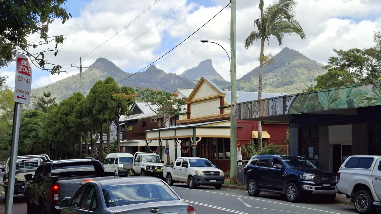 Main street of Uki, New South Wales, Australia, with mountains in background, November 2025 (Tony Rees photograph)