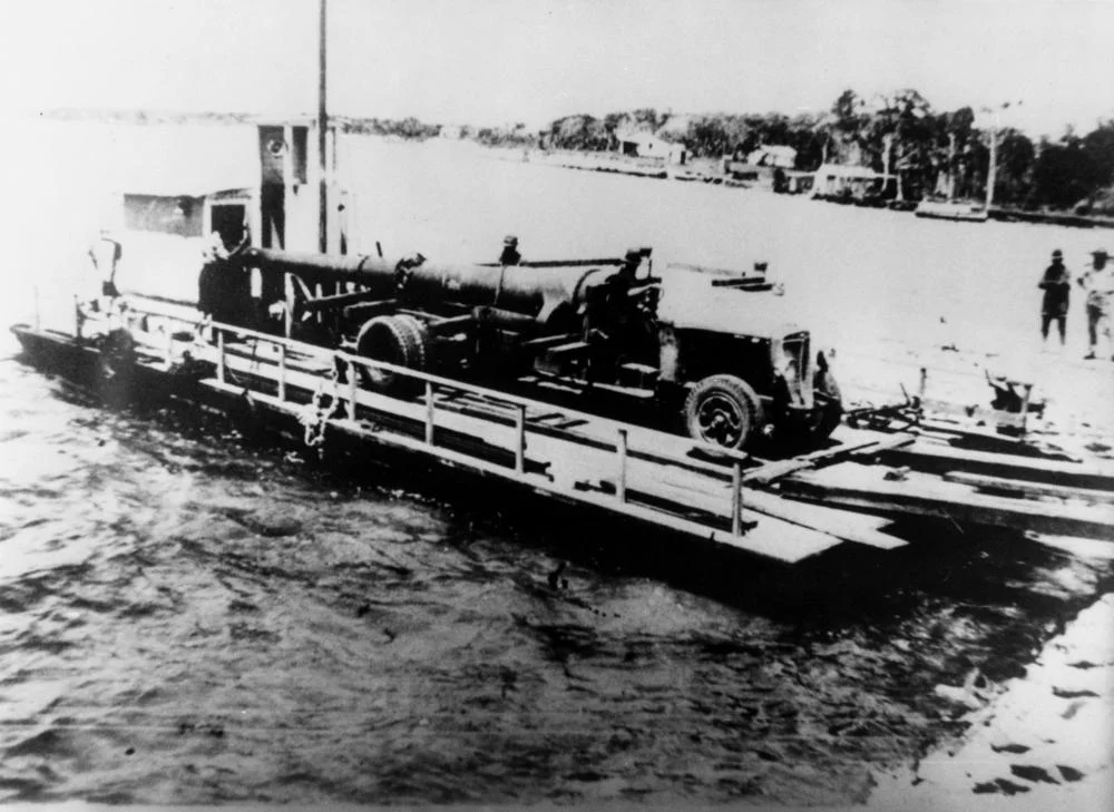 Naval gun being ferried across to Bribie Island, 1939
Naval gun is being ferried from Tripcony Park in Caloundra to Bribie Island for defence purposes in late 1939. (Description supplied with photograph).