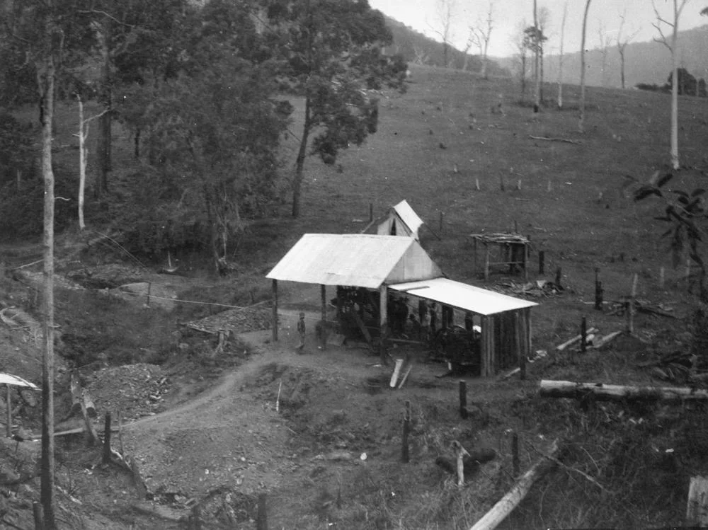 Gold mining at Kilcoy Creek, 1933
Kilcoy is in Queensland's Sunshine Coast hinterland. The town is north-west of Caboolture on the D’Aguilar Highway, just north of Lake Somerset and at the base of the Conondale Range. The area was first settled in 1841 by Scottish migrants who cleared land on the upper reaches of the Sandy and Kilcoy Creeks to run beef and dairy cattle. Timber felling and milling was also important in the early development of the town, which was established in the 1890s.