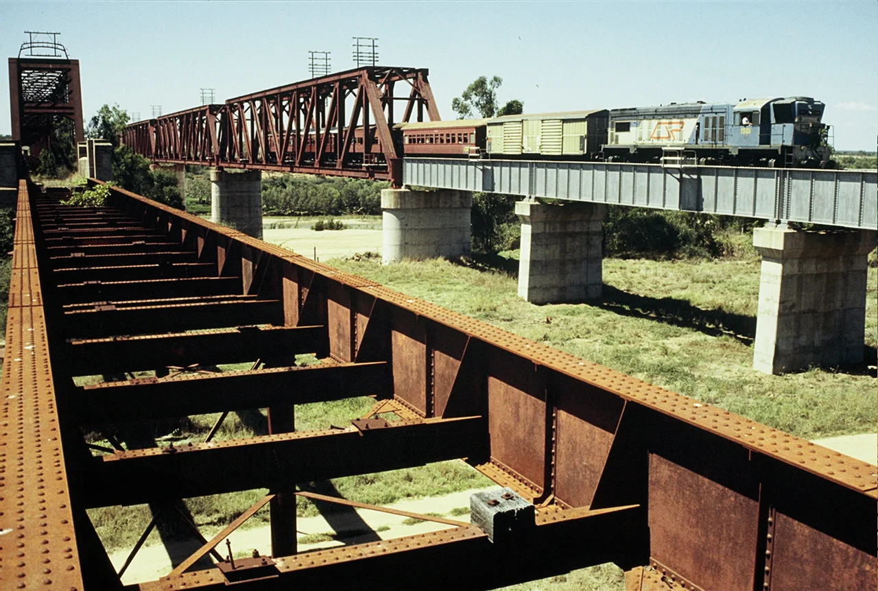 QR loco 1501 hauls a special train across the Burdekin River bridge on the Mt Isa line, September 1989