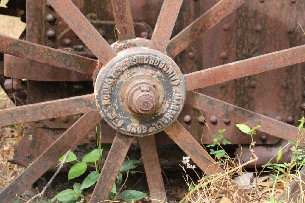 Old steam engine manufacturers plaque on wheel