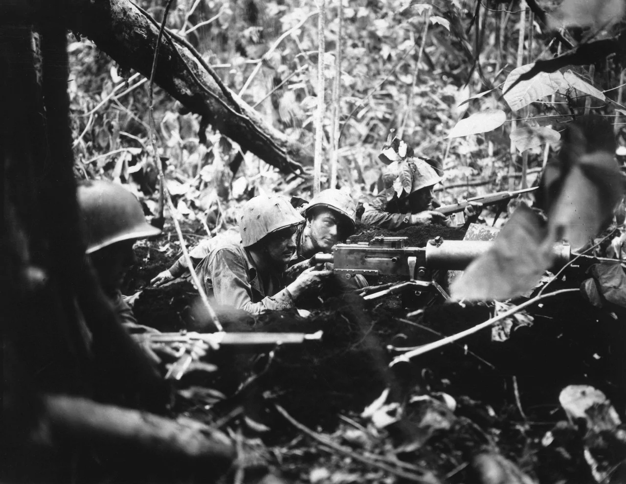 Retreating at first into the jungle of Cape Gloucester, Japanese soldiers finally gathered strength and counterattacked their Marine pursuers. These machine gunners pushed them back. (National Archives Identifier: 532522)