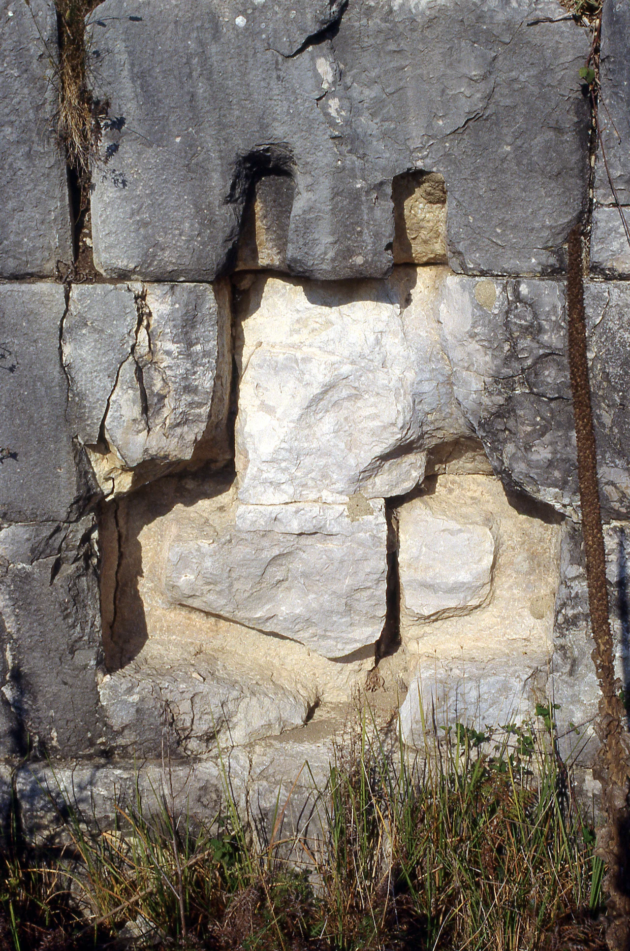 Nikopolis, Epeiros. Victory monument for the battle of Actium (Octavian's campsite memorial). Southwest face of terrace wall. Detail of cutting for rostrum (ship's prow).