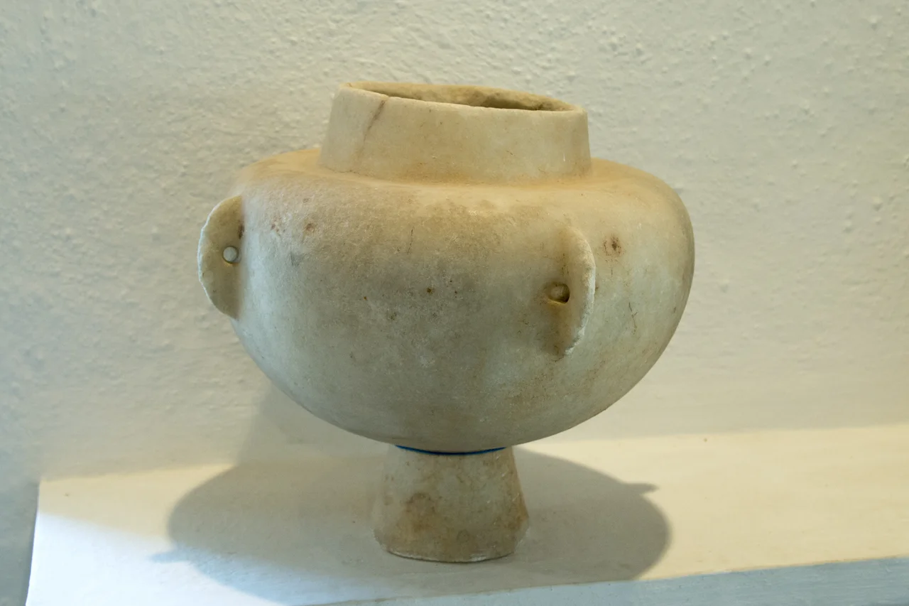 Early Cycladic kandila (chandelier) with conical foot and four vertical pierced lugs. Marble, 3rd millennium BC. Presented by Varvara Philippaki, 1979. Archaeological Muesum of Sifnos, Cat. No. 163.