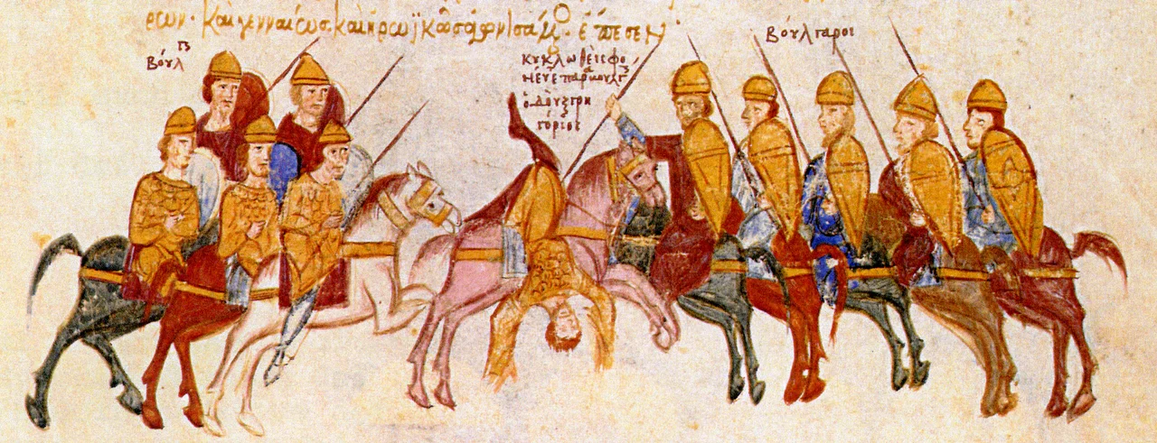 Skyllitzes Matritensis, fol. 184v, detail. 
Miniature:

Bulgarians ambush and kill the governor of Thessalonica, Duke Gregory Taronites.
Text from the Chronicle of John Skylitzes: "... Samuel was campaigning against Thessalonike. He divided the majority of his forces to man ambushes and snares but he sent a small expedition to advance right up to Thessalonike itself. When duke Gregory [Taronites] learnt of this incursion he despatched Asotios, his own son, to spy on and reconnoitre the [enemy] host and to provide him with inteligence and then he himself came along afterwards. Asiotios set out and came into conflict with the [enemy] vanguard which he put to flight, only to be taken unwittingly in an ambush. On hearing of this Gregory rushed to the help of his son, striving to deliver him from captivity, bu he too was surrounded by Bulgars; he fell fighting nobly and heroically. ..." (Translated by John Wortley, in: John Skylitzes: A Synopsis of Byzantine History, 811-1057: Translation and Notes, p. 323)
References:

Ioannis Scylitzae Synopsis Historiarum. Editio Princeps. Rec. Ioannes Thurn, p. 341, in: Corpus Fontium Historiae Byzantinae 5 Series Berolinensis, 1973
Tsamakda V.: The illustrated chronicle of Ioannes Skylitzes in Madrid, p. 221
Божилов Ив.: Българите във Византийската империя, p. 183
Grabar A., Manoussacas M.: L'illustration du manuscript de Skylitzes de Madrid, p. 100
Божков А.: Миниатюри от Мадридския ръкопис на Йоан Скилица, p. 225