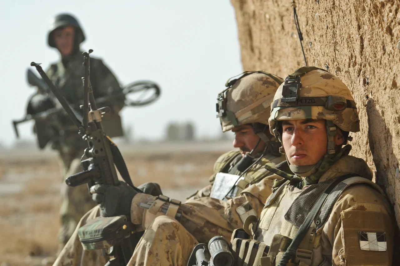 Canadian and Afghan national army soldiers patrol in Badula Qulp, Helmand province, Afghanistan, Feb. 17, 2010. Operation Moshtarak is an Afghan-led initiative to assert government authority in the centre of Helmand province. Afghan and ISAF partners are engaging in this counter- insurgency operation at the request of the Government of the Islamic Republic of Afghanistan and the Helmand provincial government. (U.S. Air Force photo by Tech. Sgt. Efren Lopez)