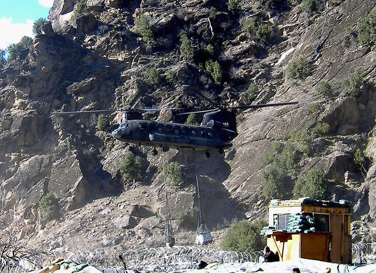 Chinook helicopter above Combat Outpost Keating, Nuristan, Afghanistan
Original caption:
" A Chinook helicopter lands at Combat Outpost Keating, Afghanistan, in this March 2007, file photo. A military investigation of a Taliban attack last fall on the remote U.S. army outpost that left eight American soldiers dead and 22 wounded has resulted in administrative punishments for two commanders blamed for "inadequate measures taken by the chain of command."
(Sgt. Amber Robinson/U.S. Army)