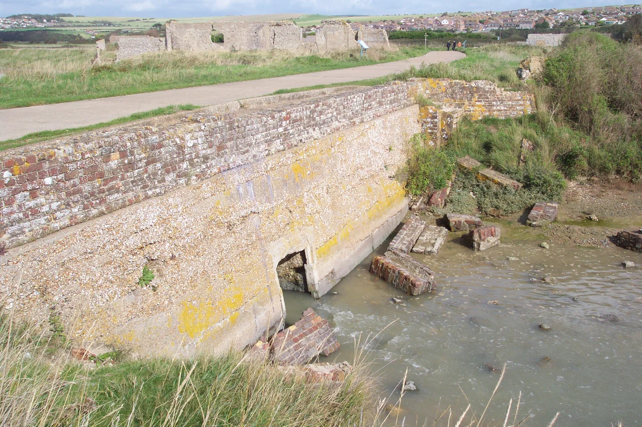Taken by Tim Trent 

Showing the ruins of the en:Tide Mills tidal mill en:sluice from the mill pond side on a rising tide.  This is the other side of the sluice from the seaward side [1]