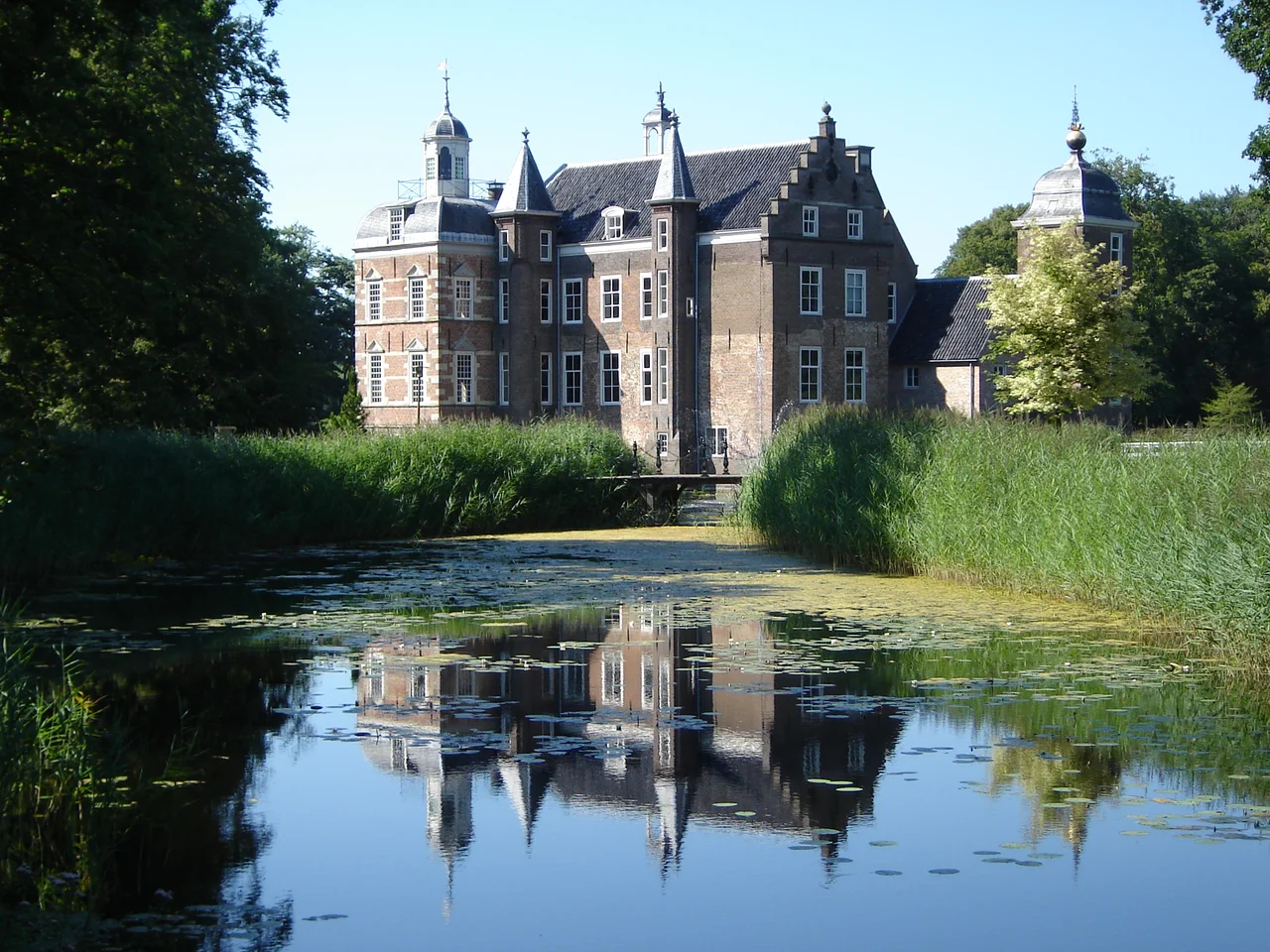 Castle "House Ruurlo", formerly municipal hall in Ruurlo, the Netherlands. View across the water from the rear