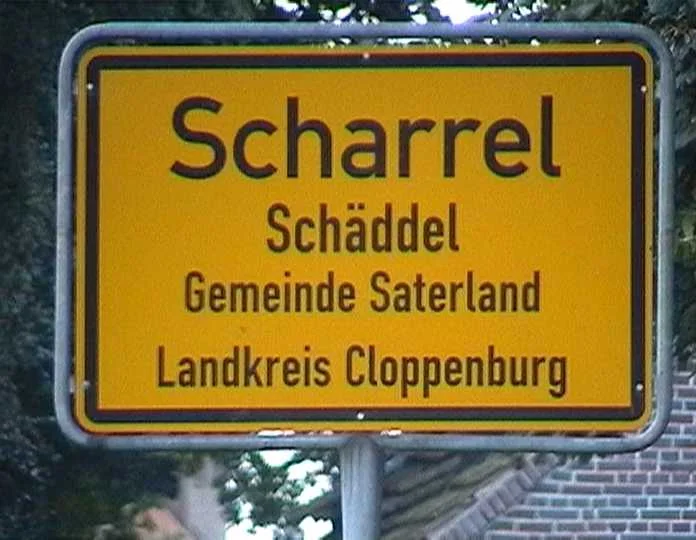 Bilingual place-name sign in Saterland.