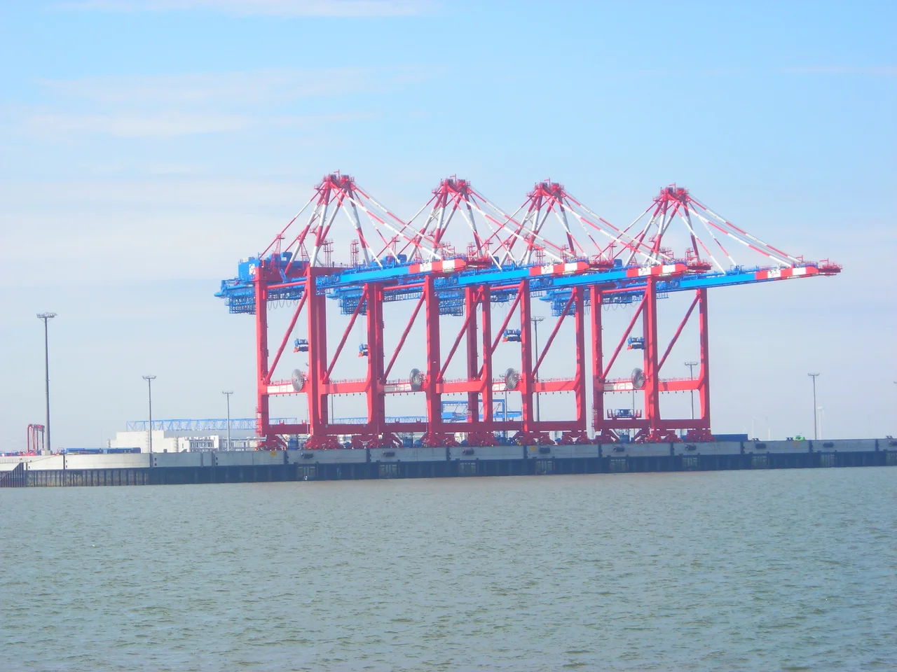 The first four container cranes of the JadeWeserPort seen from the seaside