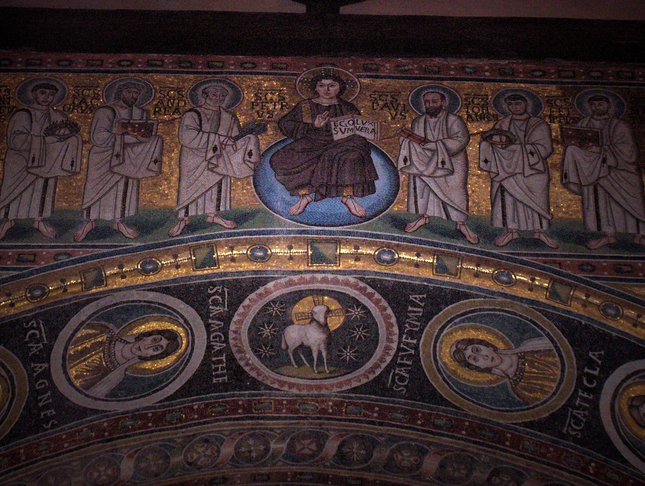 Mosaic with young Christ holding a book with the text "Ego sum lux vera" (I am the true light); on His left and right : six apostles;apse of   the St. Euphrasius basilica, Poreč, Croatia