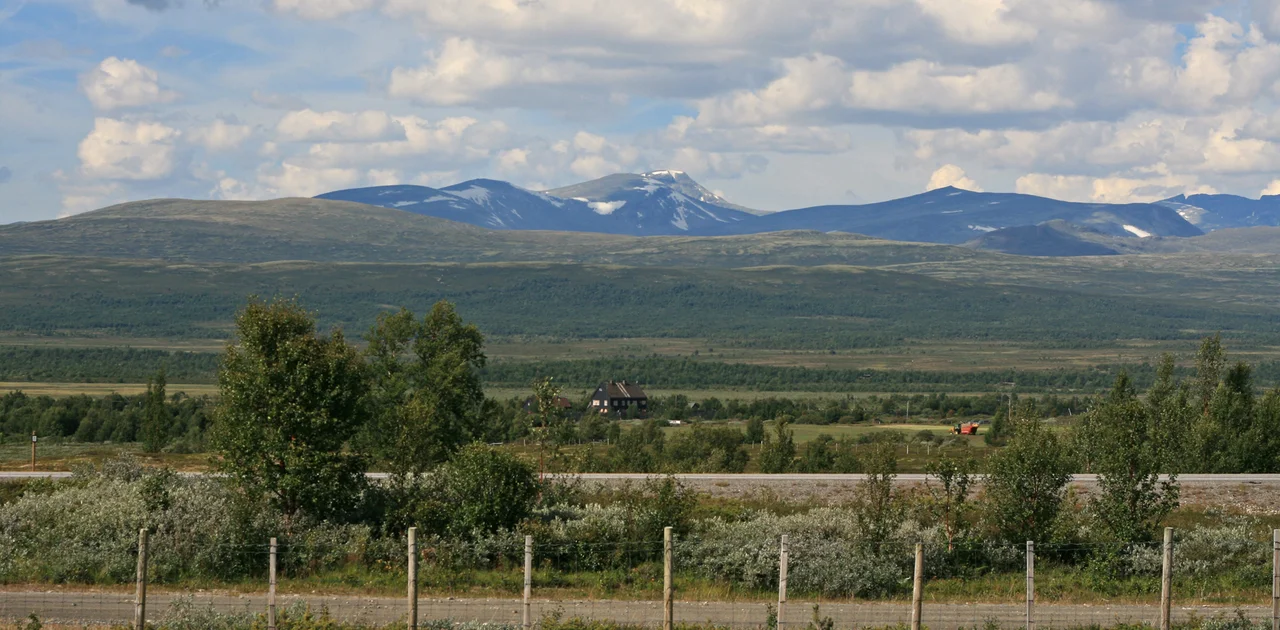 Dovrefjell plateau, Norway. Foreground: E6 and Fokstua railway station. Background: Snøhetta mountain.