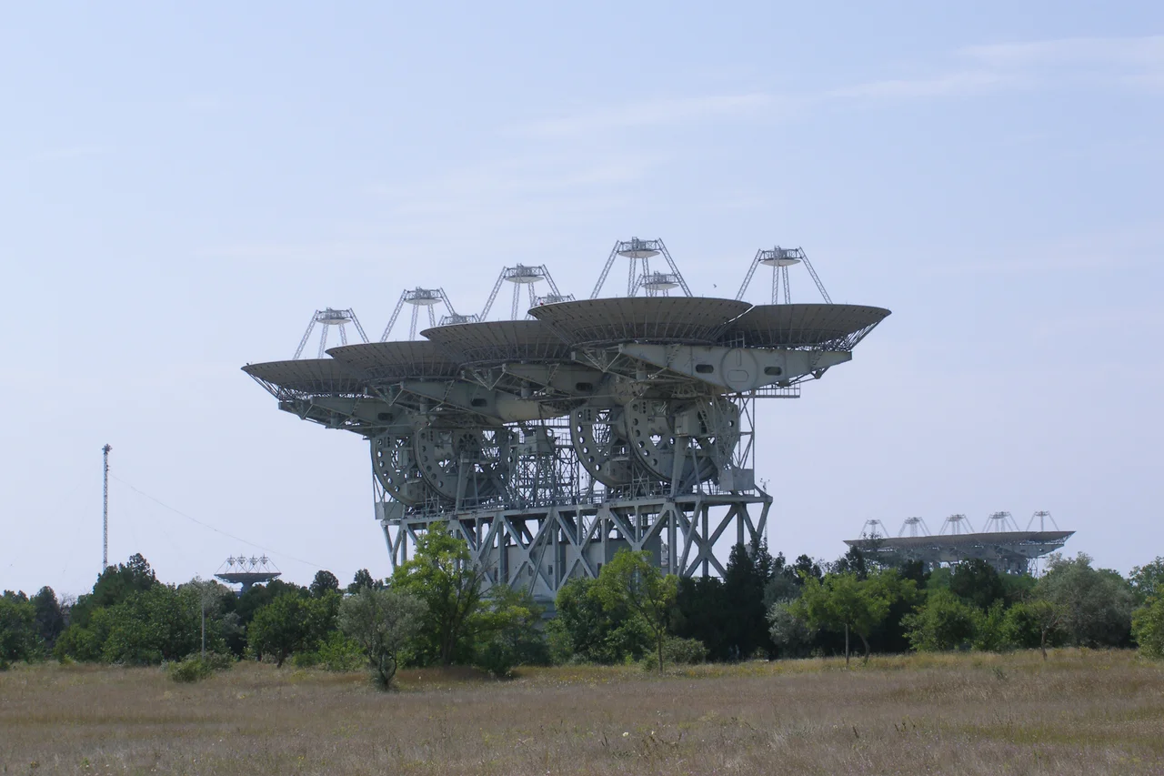 Pluton deep space communications and planetary radar in Crimea. An assembly of eight reflector antennas, each with diameter of 16 metres. The Pluton complex supported all the Soviet space programs until 1978. In 1962, Pluton sent messages, first radio broadcasts for extraterrestrial civilizations in the history of mankind, in the direction of a star in the constellation Libra. Evpatoria Center for Deep Space Communications and Exploration. North Station. Vitino, Crimea.