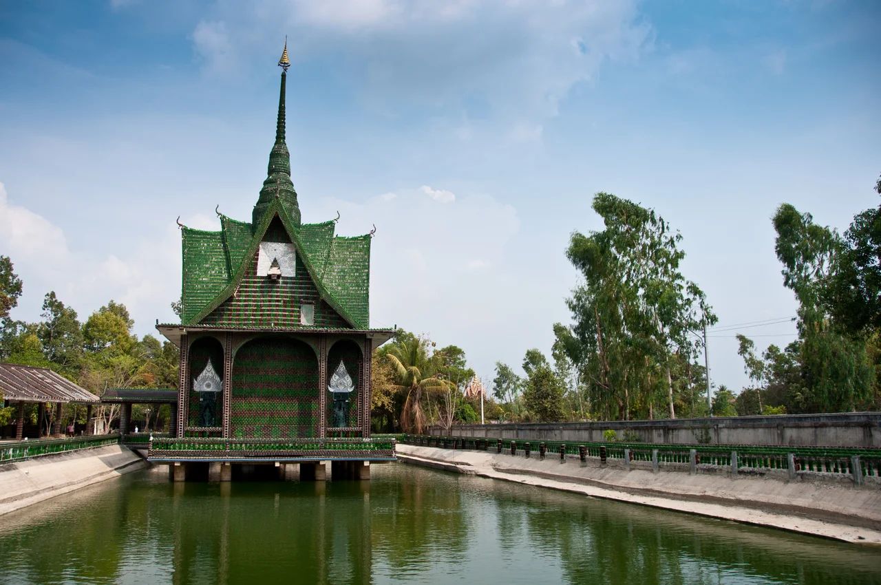 The main building at Wat Pa Maha Chedio Kaew, more commonly know as "The Million Bottle Temple" or "Wat Lan Kuad" in Thai.  This Buddhist temple about 300 miles from Bangkok is decorated with more than a million recycled bottles.