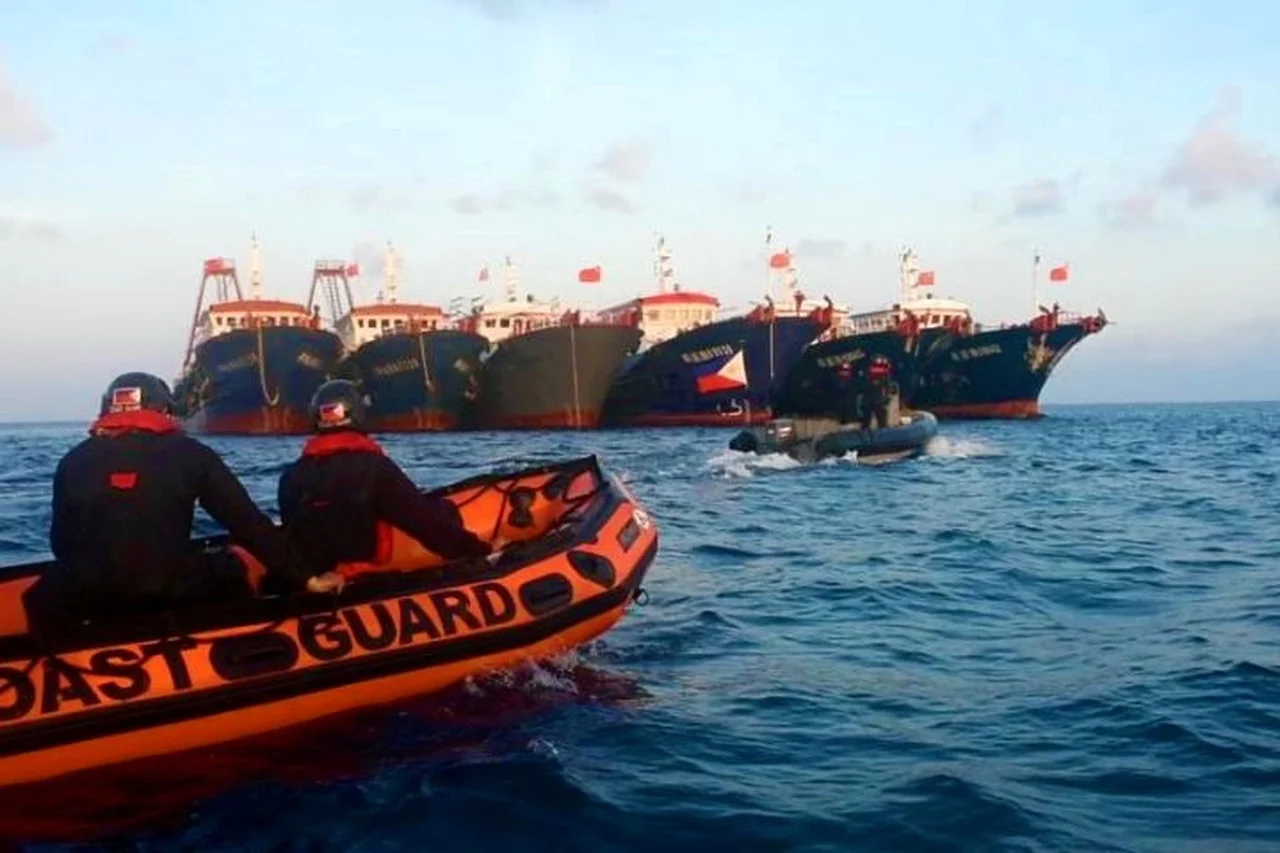 The BRP Cabra of the Philippine Coast Guard and two vessels of the Bureau of Fisheries and Aquatic Resources approaches Chinese-flagged ships at Whitsun Reef (known as Julian Felipe Reef in the Philippines) on April 13, 2021 during maritime patrol operations.