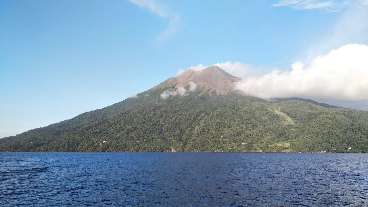 The peak of Mount Karangetang is seen from the western side of the island of Siau.