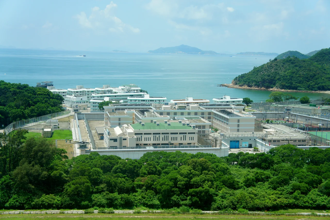 Shek Pik Prison (Maximum security institution), 47 Shek Pik Reservoir Road, Lantau Island, Hong Kong.
Guishan Island of Zhuhai is visible in the distance.