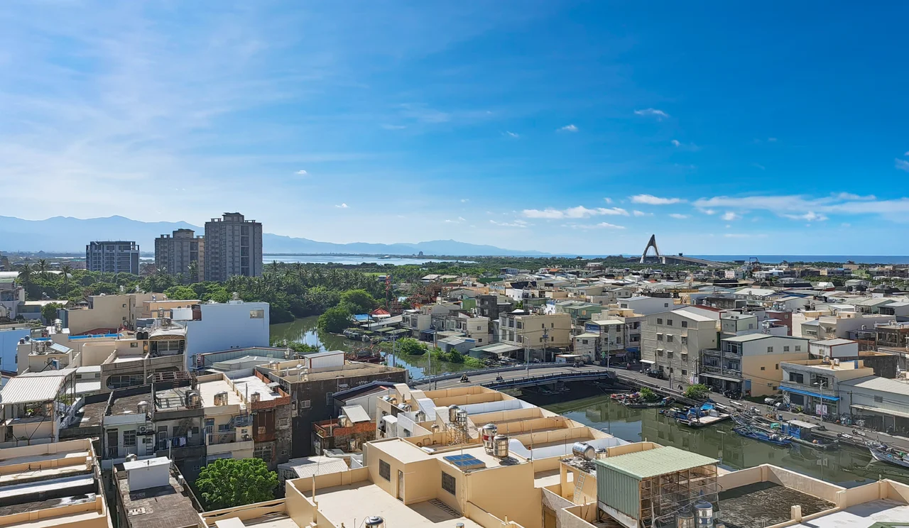 Skyline of southern town centre of Donggang in Pingtung, Taiwan. The southern part of Central Range can also be seen in the distance.