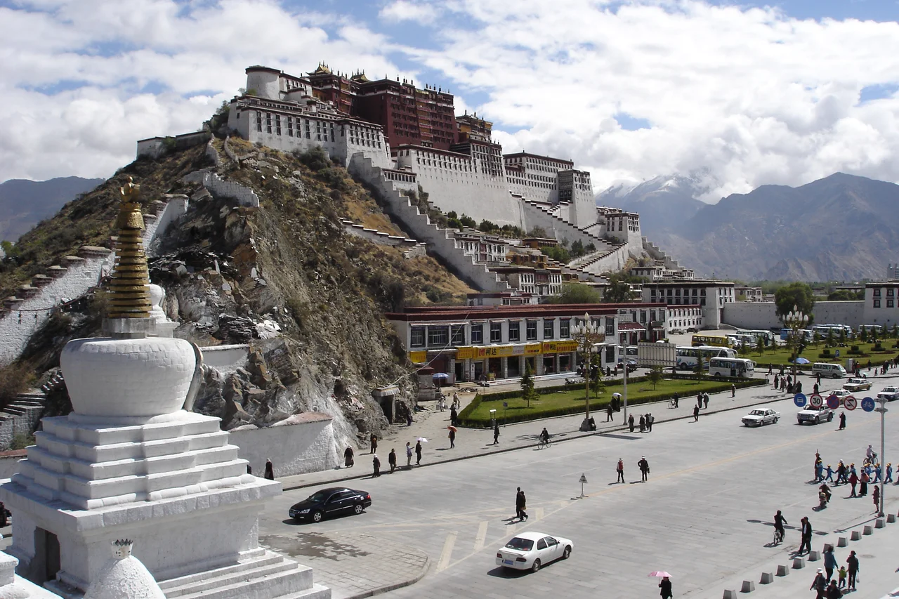 Lhasa is spread across the valley floor. The Potala Palace rises from the old city.