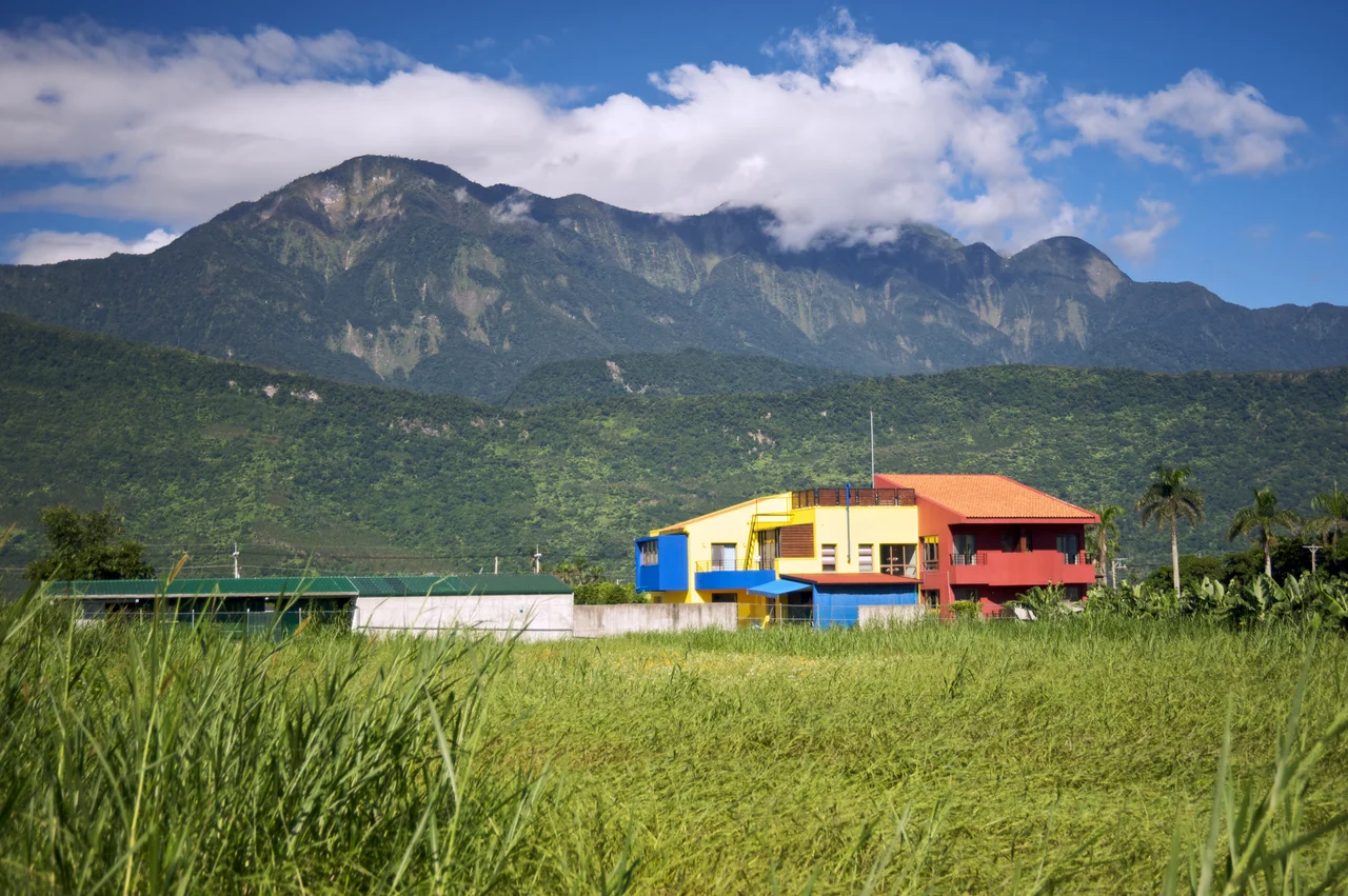 A farmer's resideence in Hualien County, Taiwan, with the Coastal Mountain Range in the background.