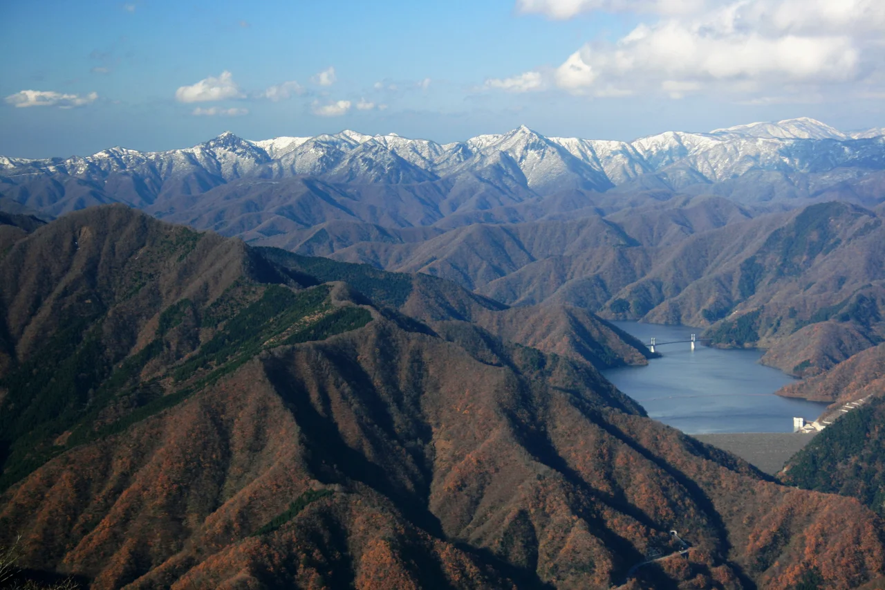 Mount Kanmuri and Tokuyama Dam seen from Mount Hanabusa, in Ibigawa, Gifu prefecture, Japan.
