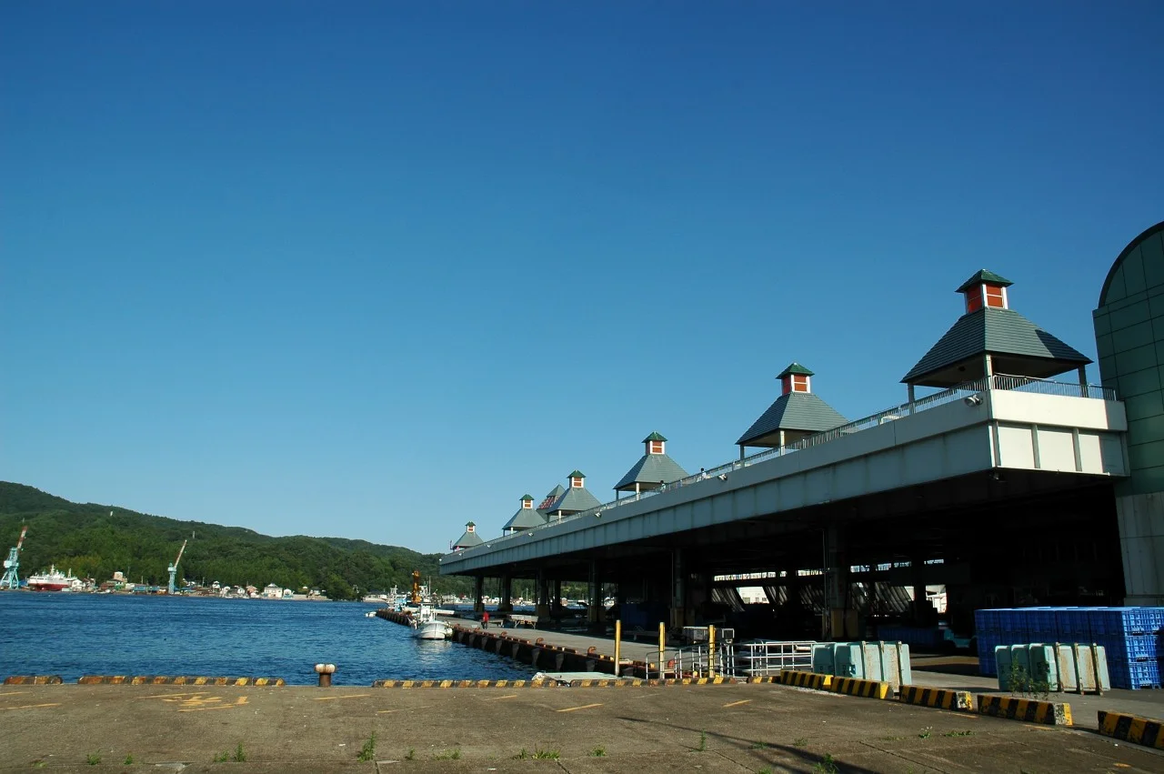 Port of Kesennuma after earthquake in Kesennuma, Miyagi. The scorching fishing boats run aground in the quay.